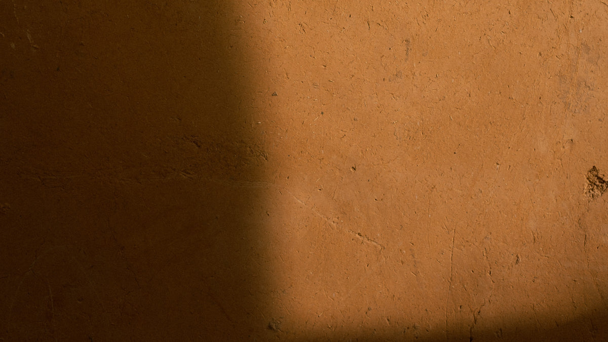 Clay notes, ochre wall